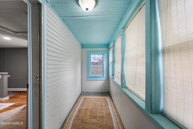 a view of a hallway with white walls