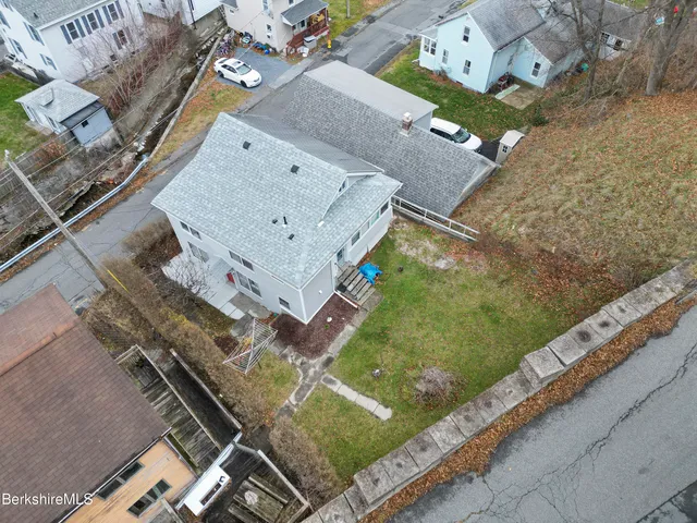 an aerial view of residential house with outdoor space
