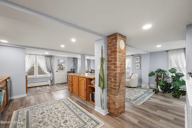 a living room with furniture and a rug