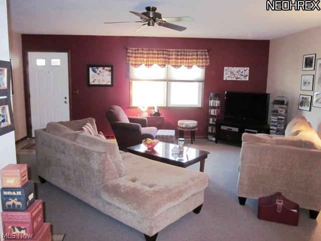 552 Guilford Road Vermilion, OH 44089 - Photo 6 of 18 Once you step inside, you're greeted by a generous sized living room that is open to the formal dining room.