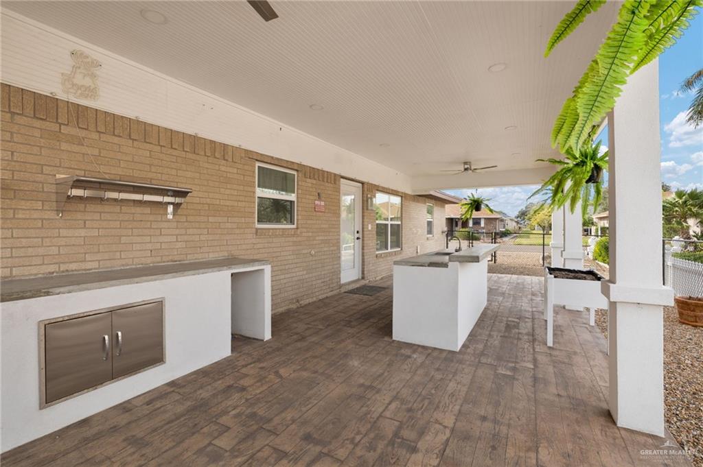 400 Taurus Street Mission, TX 78572 - Photo 18 of 18 a view of a kitchen with furniture and wooden floor