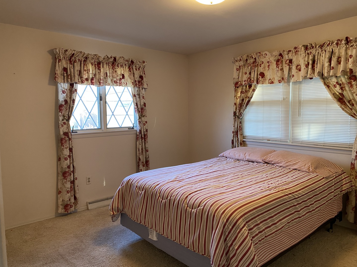 227 East Caroline Street Spring Valley, IL 61362 - Photo 10 of 16 a bed sitting in a bedroom next to a window