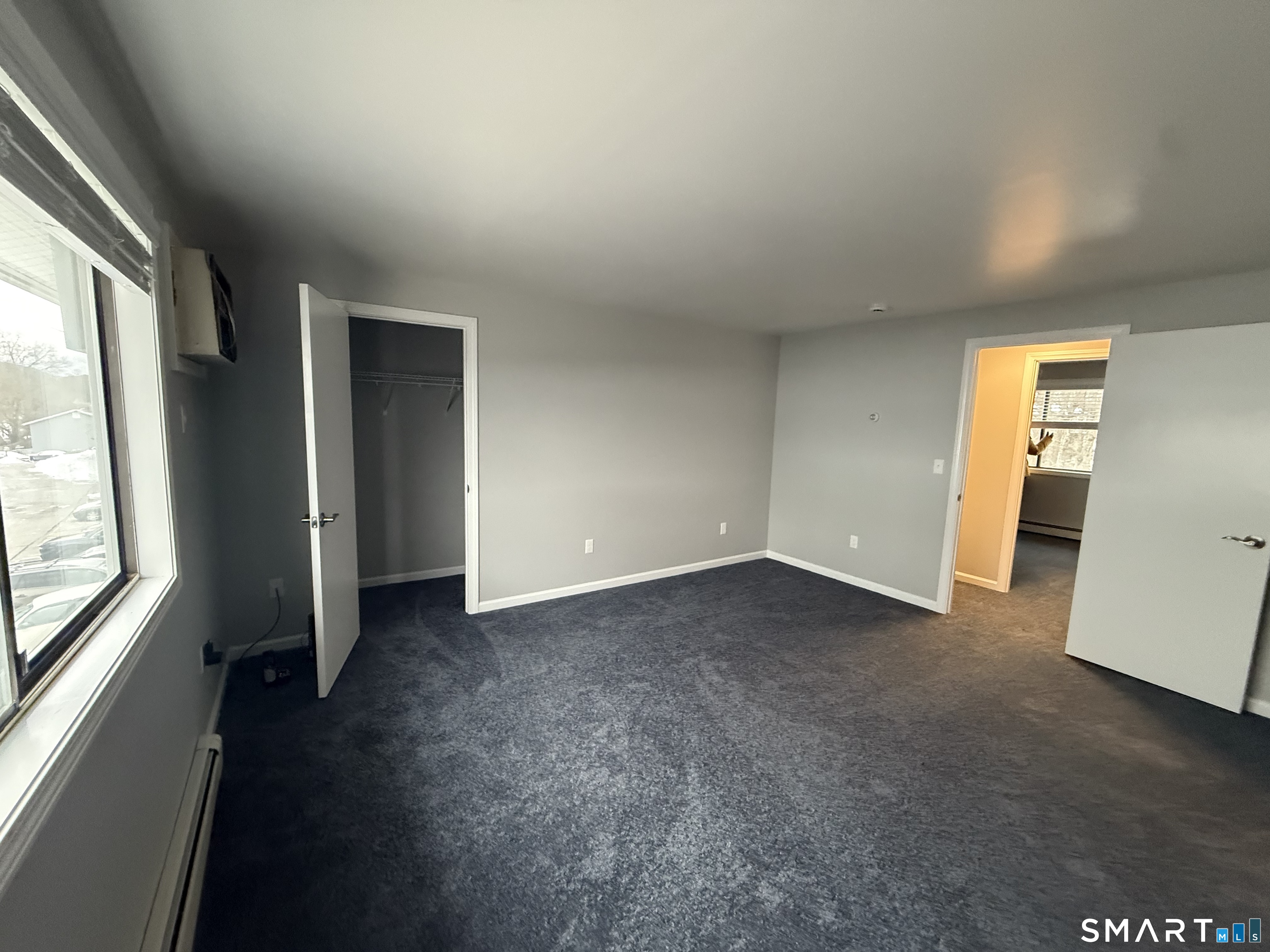 292 Meridian Street, Unit K Groton, CT 06340 - Photo 16 of 20 an empty room with windows