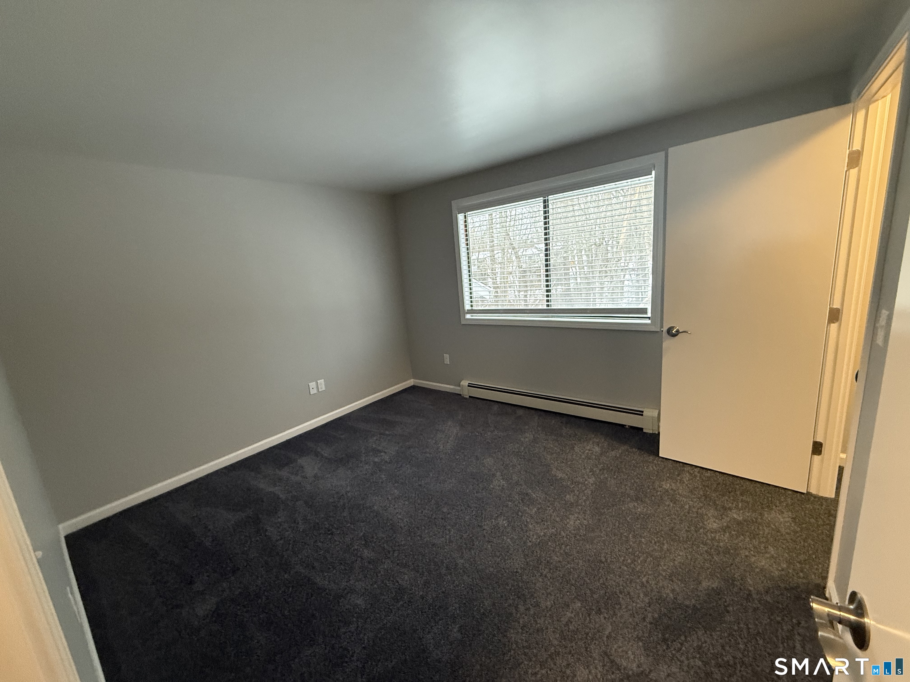 292 Meridian Street, Unit K Groton, CT 06340 - Photo 18 of 20 an empty room with a window