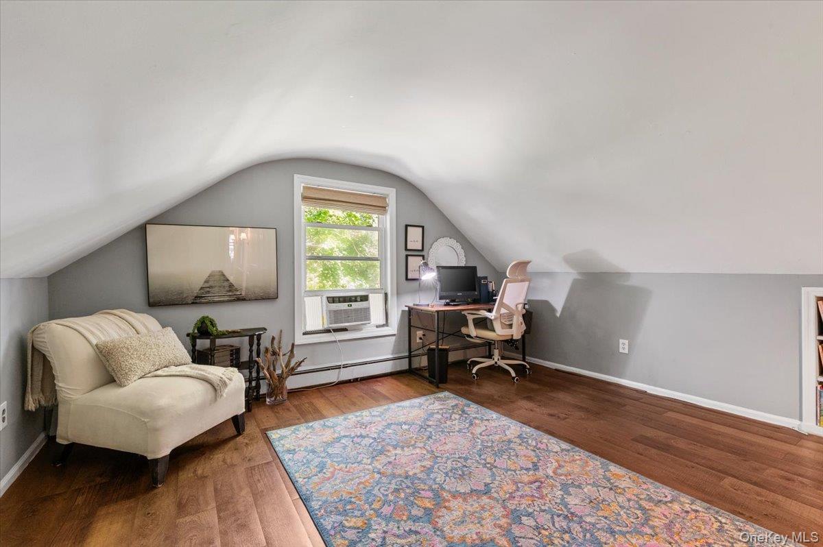 10 Rancher Place Huntington, NY 11743 - Photo 28 of 44 Attic living space featuring wood-finish flooring and a window with blinds