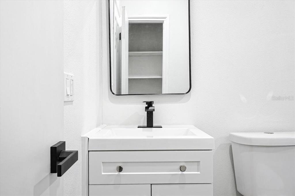 4061 Ferrow Street Orlando, FL 32811 - Photo 15 of 31 a bathroom with a sink and a toilet