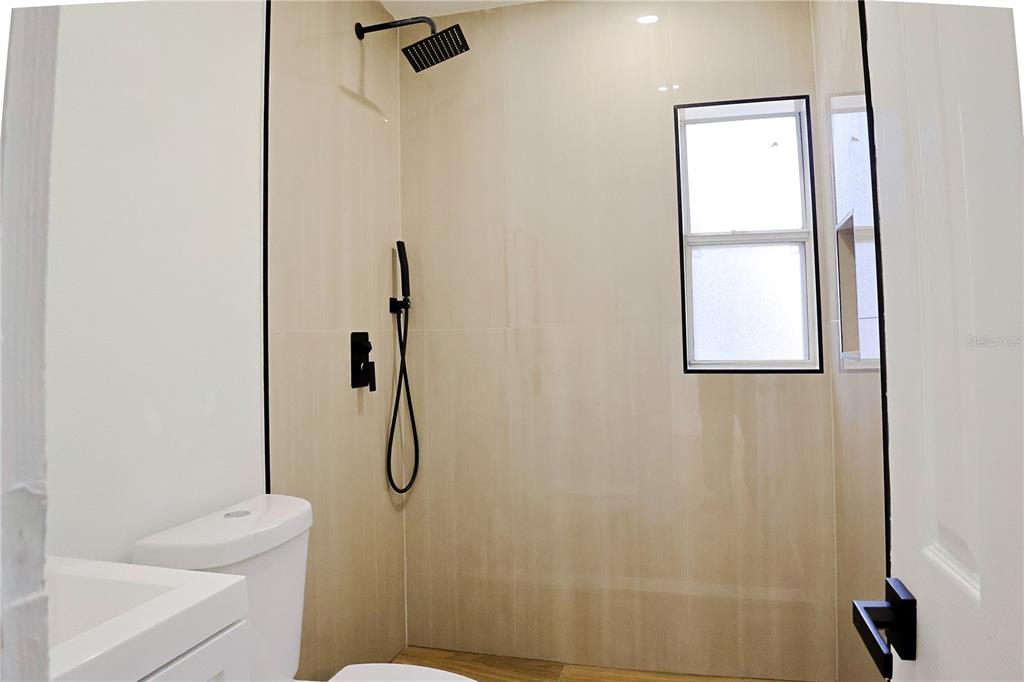 4061 Ferrow Street Orlando, FL 32811 - Photo 18 of 31 a bathroom with a shower