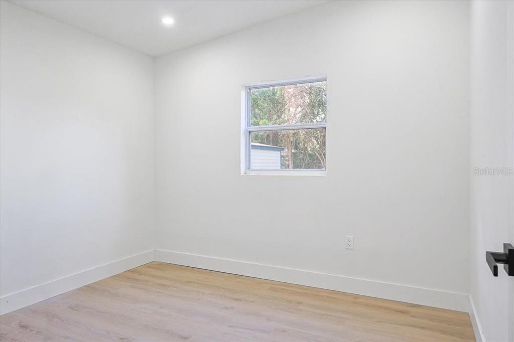 4061 Ferrow Street Orlando, FL 32811 - Photo 20 of 31 an empty room with a window
