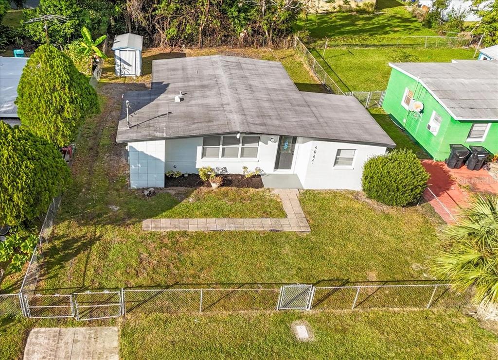 4061 Ferrow Street Orlando, FL 32811 - Photo 29 of 31 a front view of a house with a yard