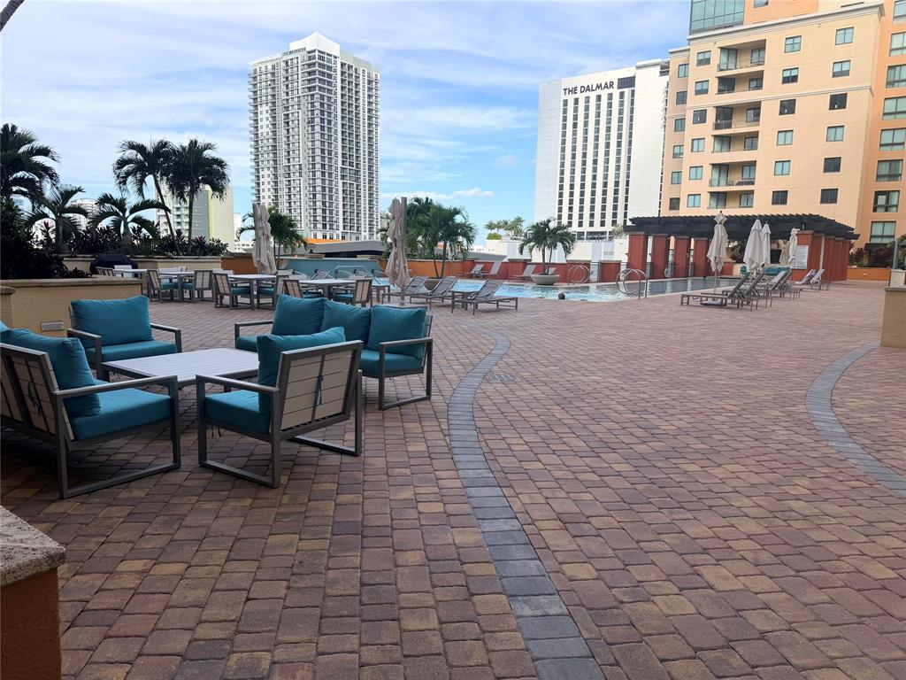 100 North Federal Highway, Unit 1226 Fort Lauderdale, FL 33301 - Photo 17 of 29 a roof deck with outdoor seating and city view