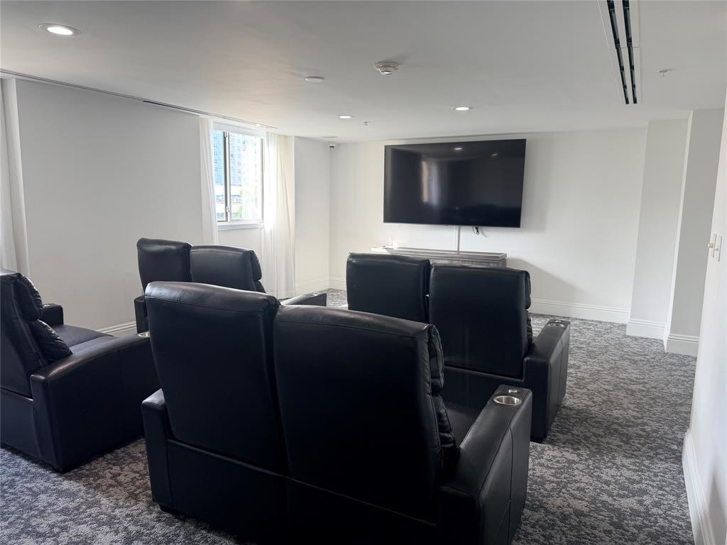 100 North Federal Highway, Unit 1226 Fort Lauderdale, FL 33301 - Photo 25 of 29 a living room with furniture and a flat screen tv