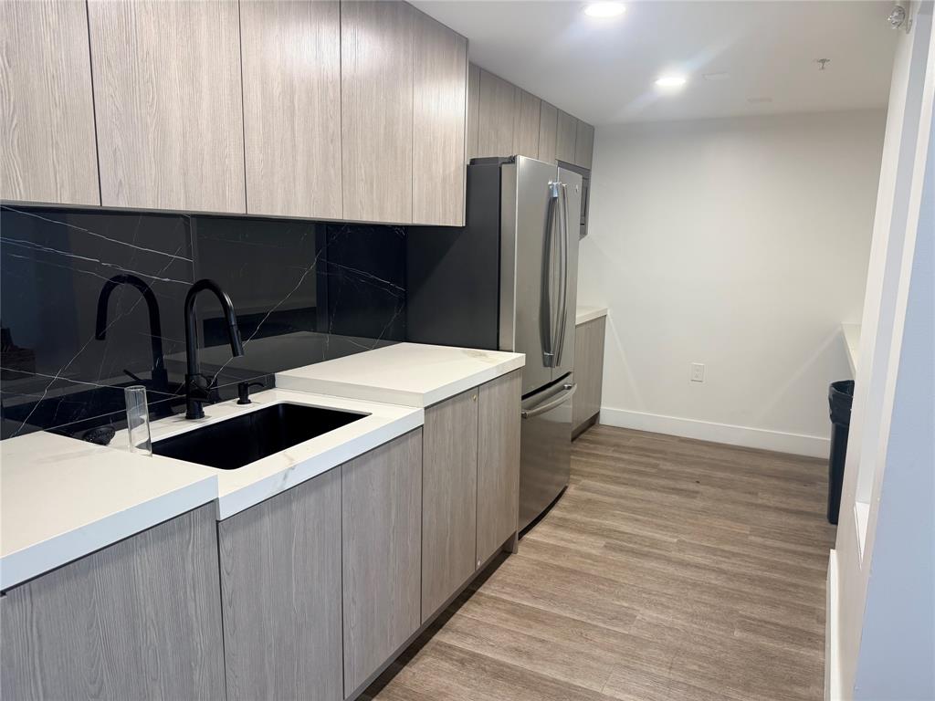 100 North Federal Highway, Unit 1226 Fort Lauderdale, FL 33301 - Photo 26 of 29 a kitchen with a sink and a refrigerator