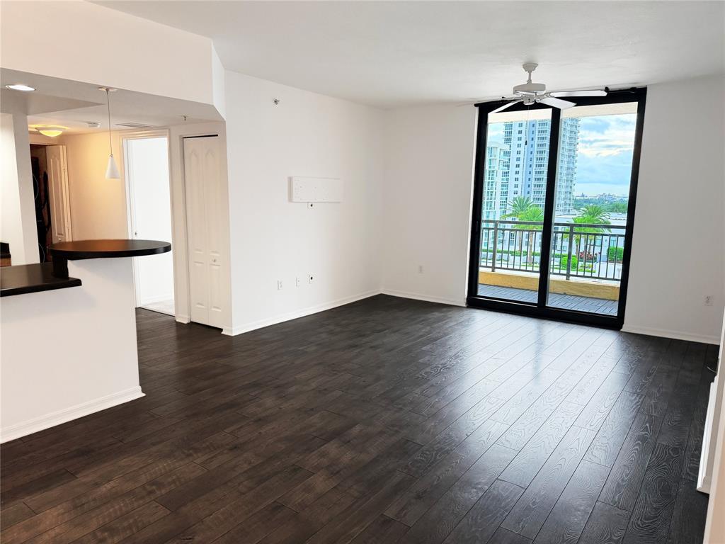 100 North Federal Highway, Unit 1226 Fort Lauderdale, FL 33301 - Photo 4 of 29 an empty room with wooden floor and windows