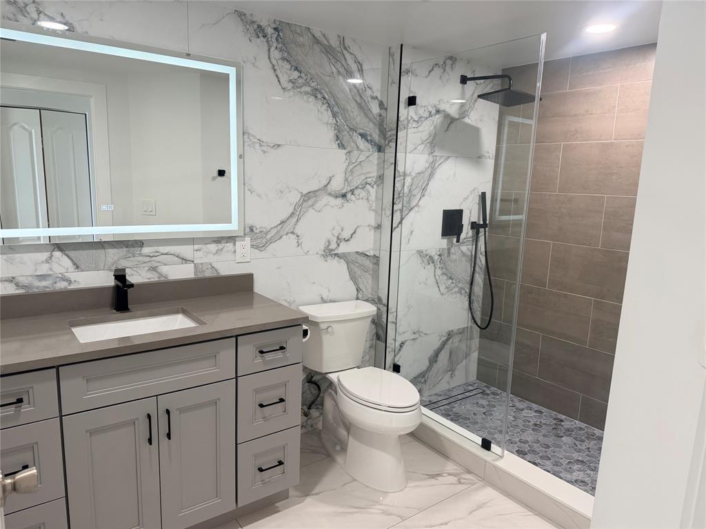 100 North Federal Highway, Unit 1226 Fort Lauderdale, FL 33301 - Photo 8 of 29 a bathroom with a sink a toilet and shower