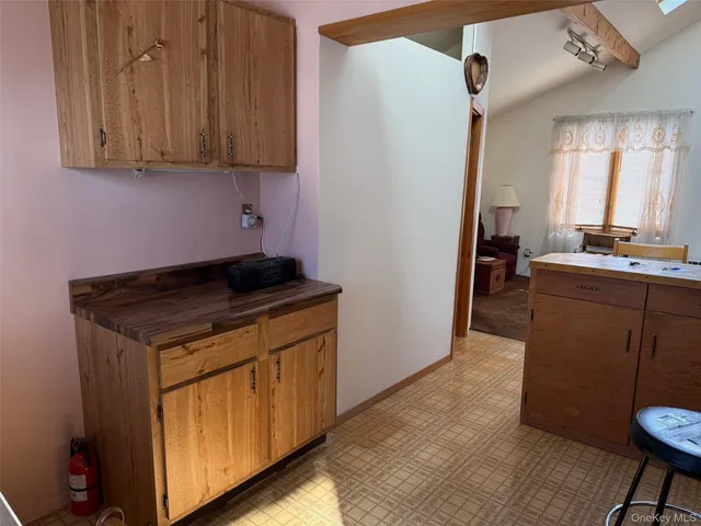 a kitchen with a stove and a refrigerator