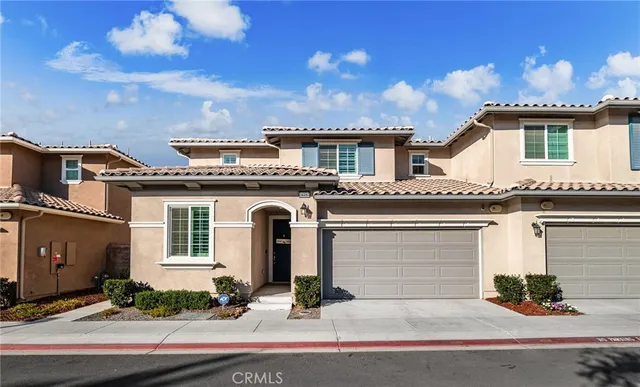 a front view of a house with yard
