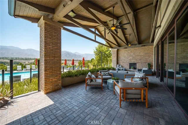 a patio with patio couch and wooden floor