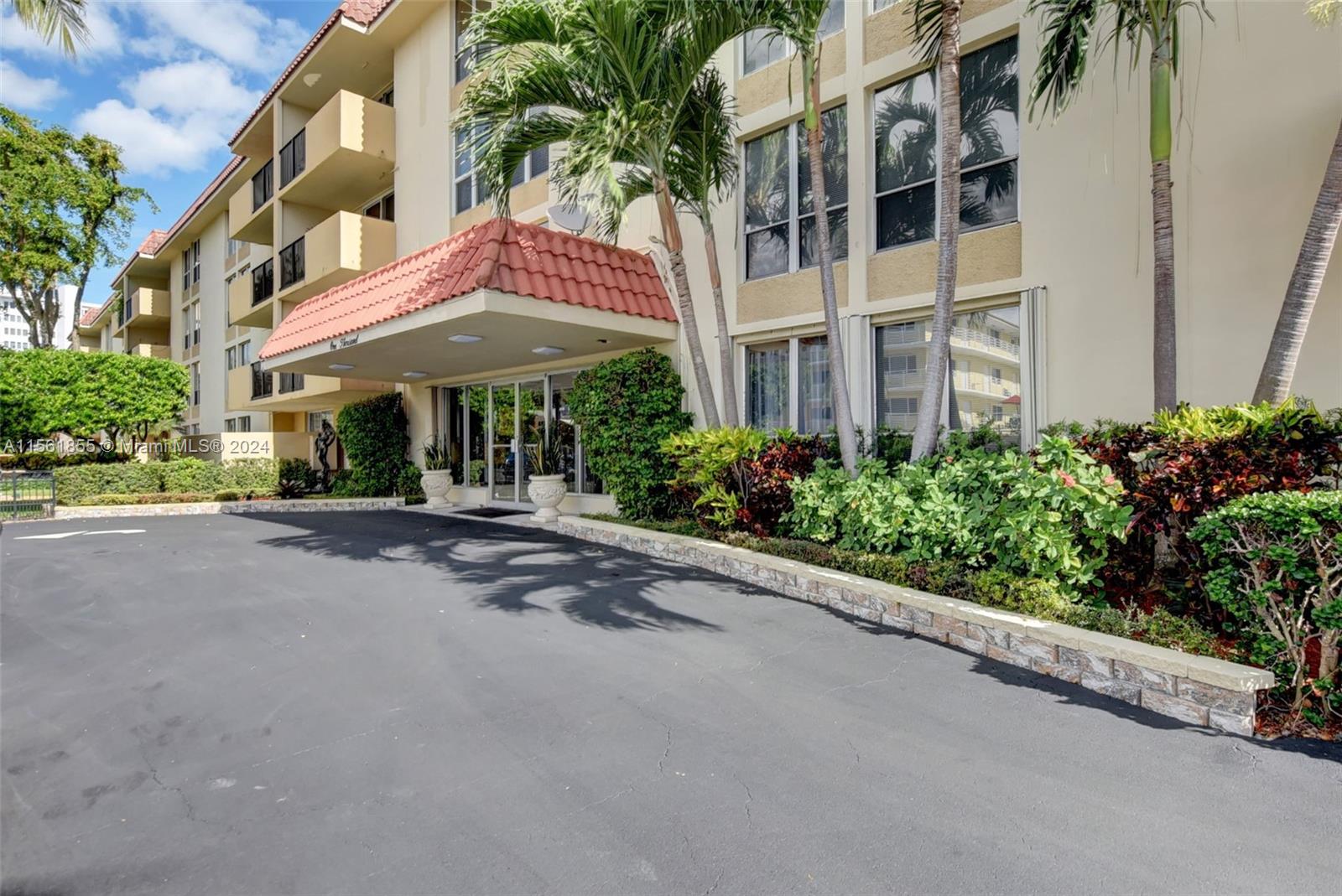 1000 Spanish River Road, Unit 2F Boca Raton, FL 33432 - Photo 1 of 53 a under view of a building with a garden