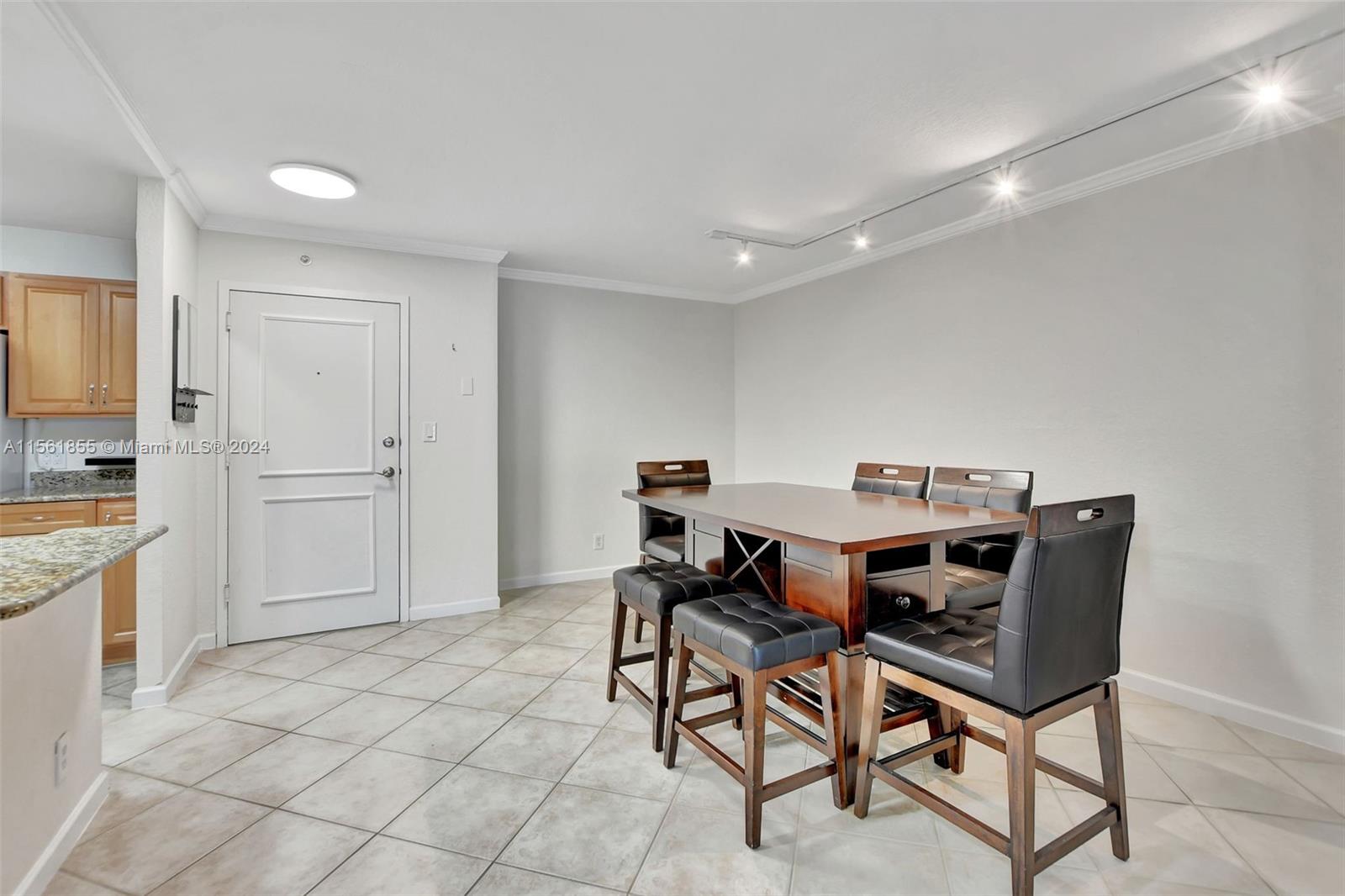 1000 Spanish River Road, Unit 2F Boca Raton, FL 33432 - Photo 8 of 53 a workspace with furniture and window