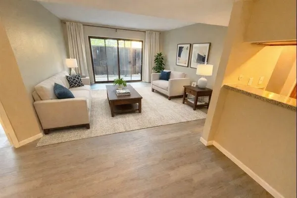 a living room with furniture and a large window