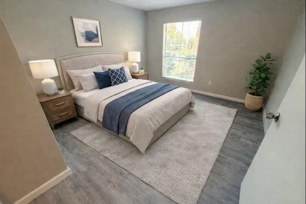 a bedroom with a bed and a couch