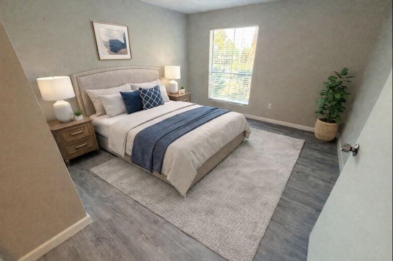 3085 Walnut Bend Lane, Unit 16 Houston, TX 77042 - Photo 5 of 13 a bedroom with a bed and a couch