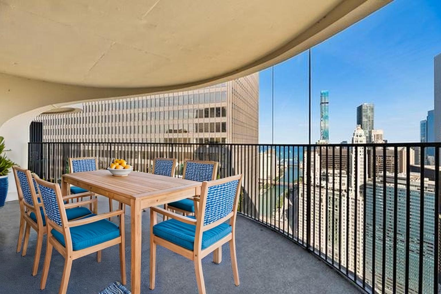 300 North State Street, Unit 5620 Chicago, IL 60654 - Photo 11 of 12 a view of a chairs and table in the balcony