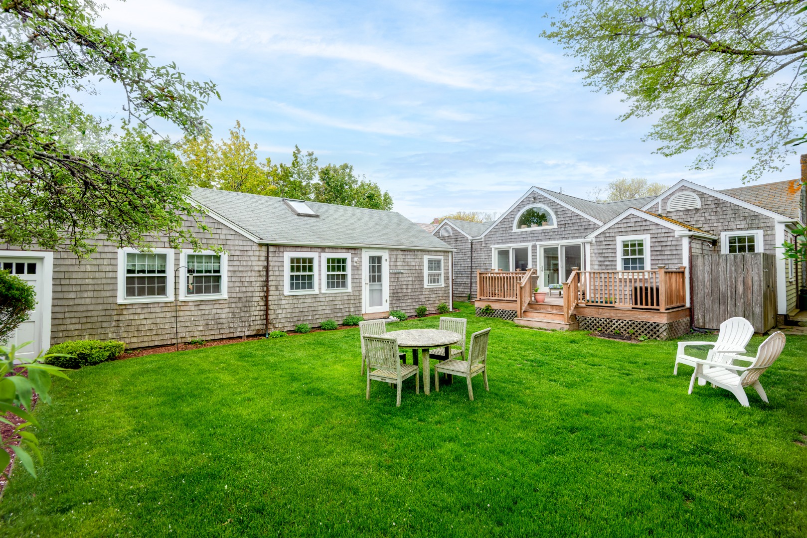 12 King Street Nantucket, MA 02554 - Photo 2 of 32 a front view of a house with a garden