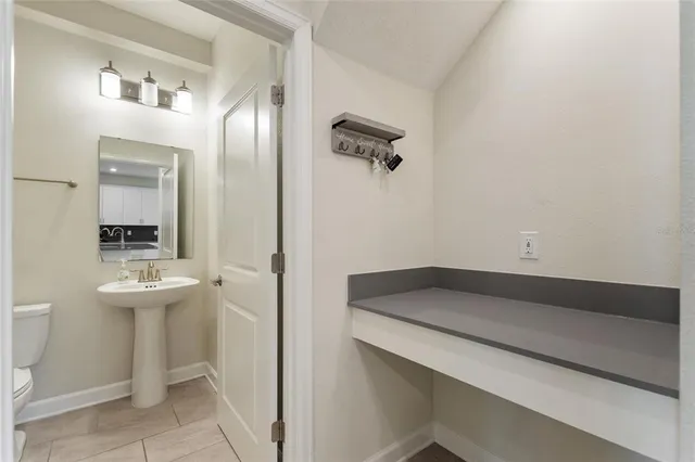 a view of kitchen with refrigerator and window