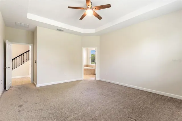 a spacious bathroom with a tub sink a mirror and a shower