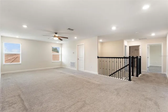a white bath tub sitting next to a white toilet and a shower