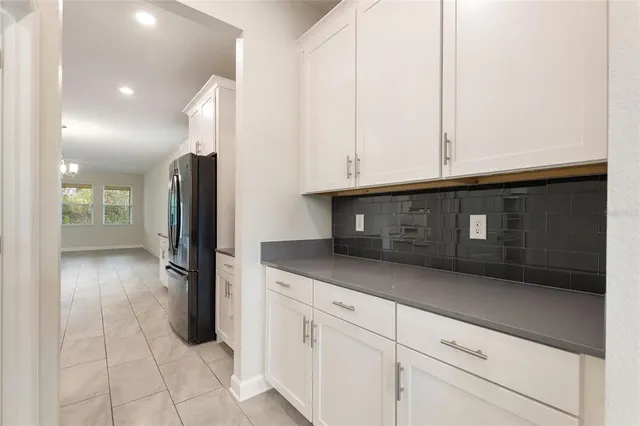 a kitchen with stainless steel appliances kitchen island granite countertop a sink and cabinets