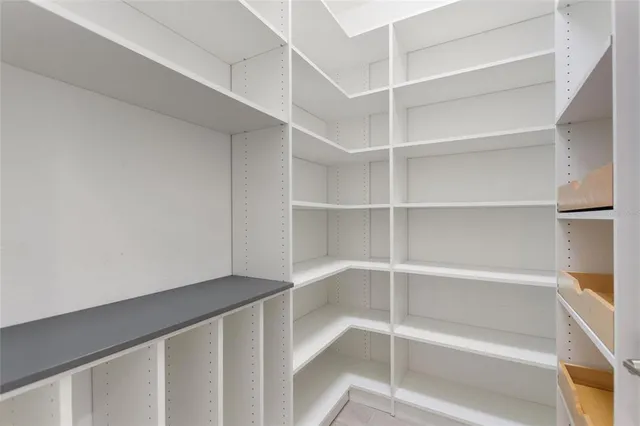 a kitchen with kitchen island a sink appliances and cabinets