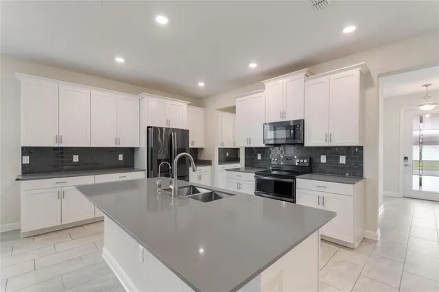 a bathroom with a sink and mirror