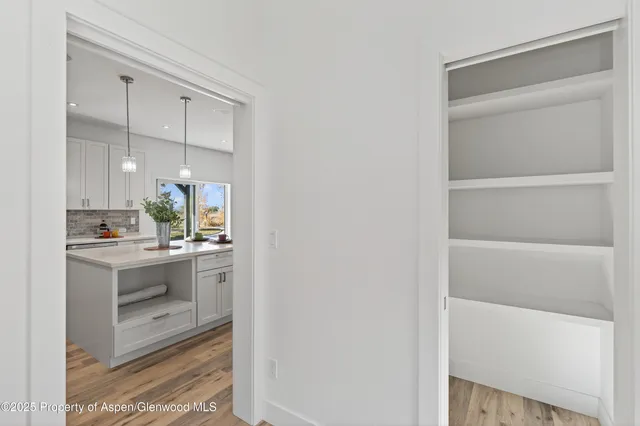 a bathroom with a double vanity sink and mirror
