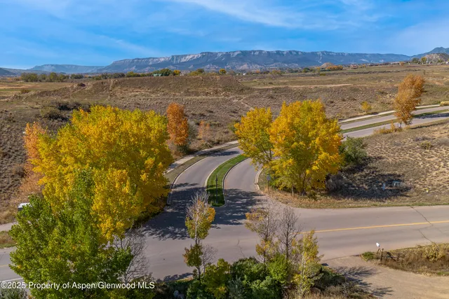 a view of a lake with houses in the back