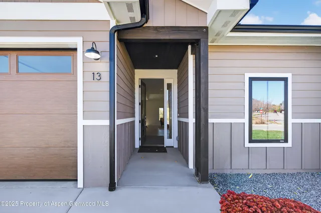 a view of a hallway with a outdoor space