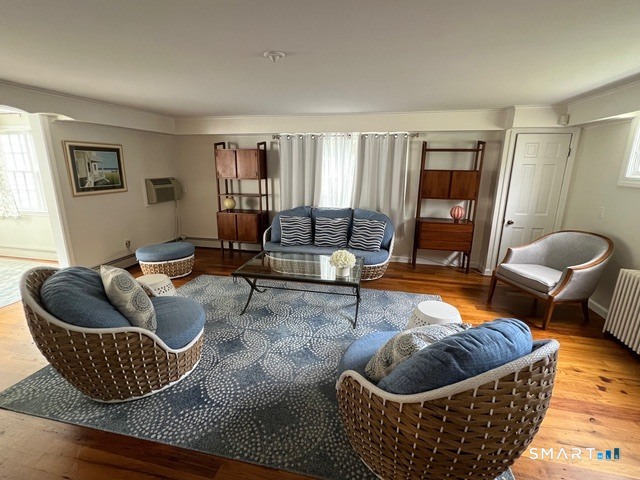 437 Hulls Farm Road Fairfield, CT 06890 - Photo 7 of 15 a living room with furniture and a couch