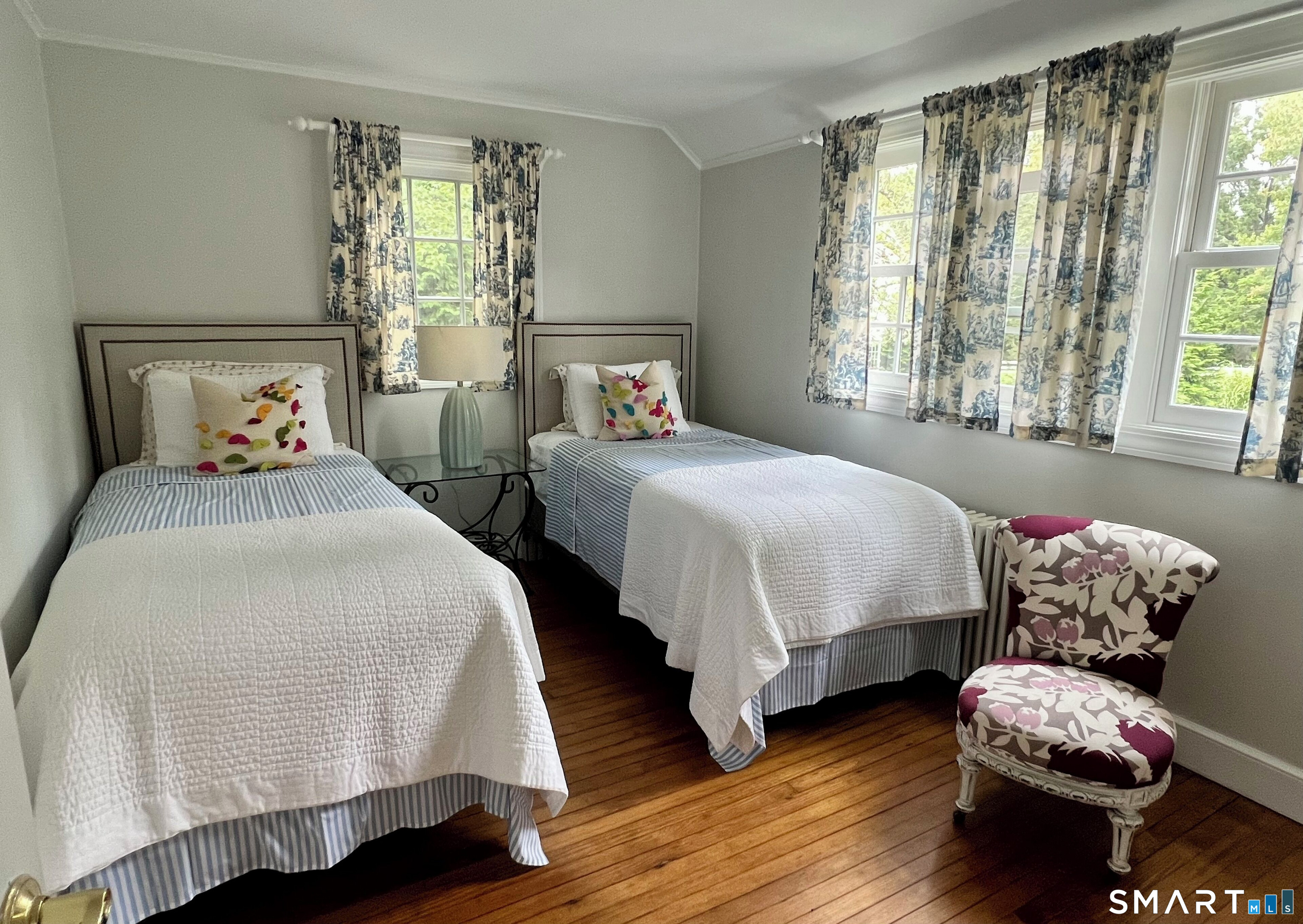 437 Hulls Farm Road Fairfield, CT 06890 - Photo 10 of 15 a bedroom with two beds and a window