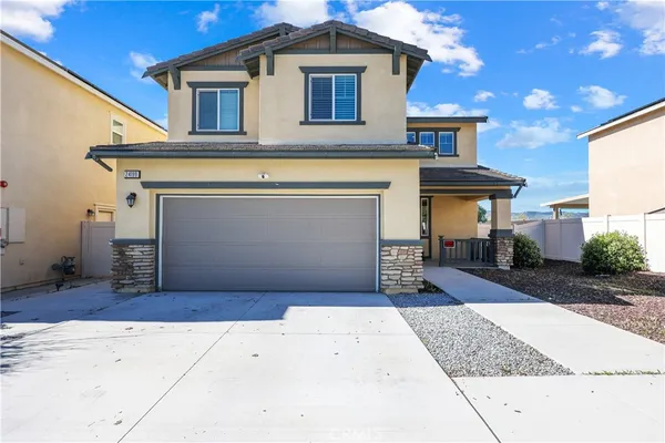 a front view of a house with a garage
