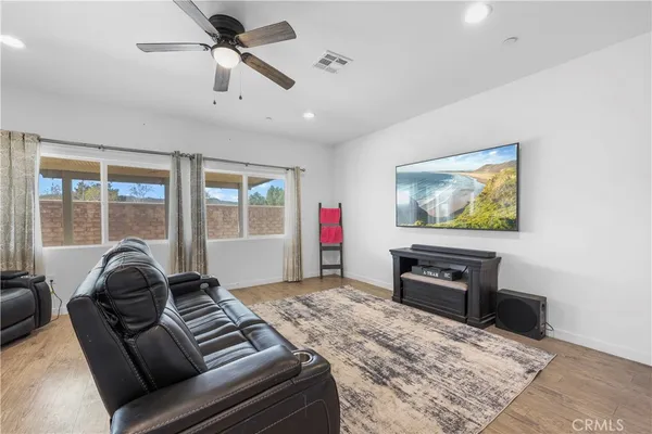 a living room with furniture or couch and a flat screen tv