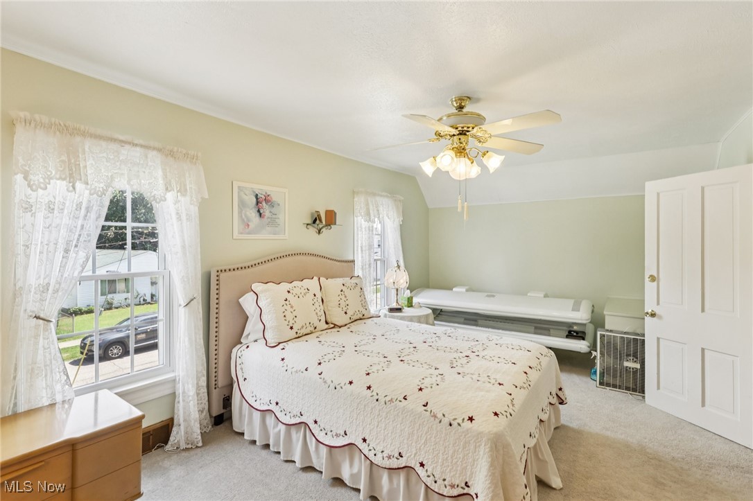 10818 Dixon Road Cleveland, OH 44111 - Photo 26 of 44 Bedroom featuring light carpet and ceiling fan