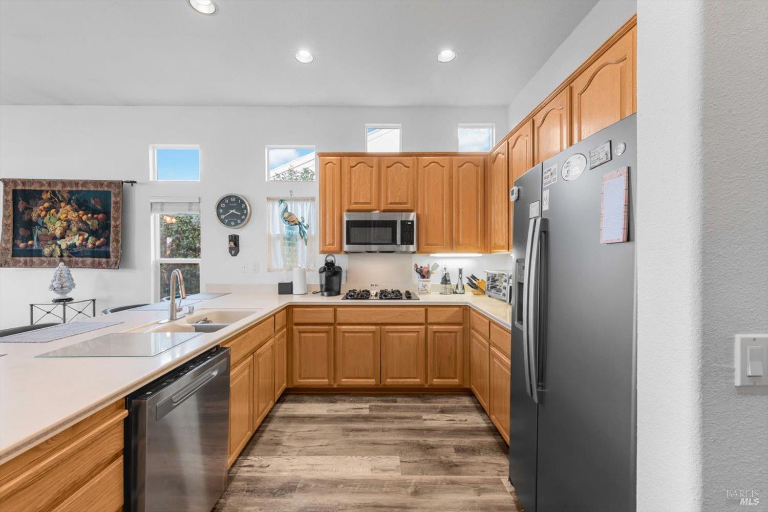 2121 St Andrews Drive Rio Vista, CA 94571 - Photo 11 of 53 a kitchen with stainless steel appliances granite countertop a refrigerator and a sink
