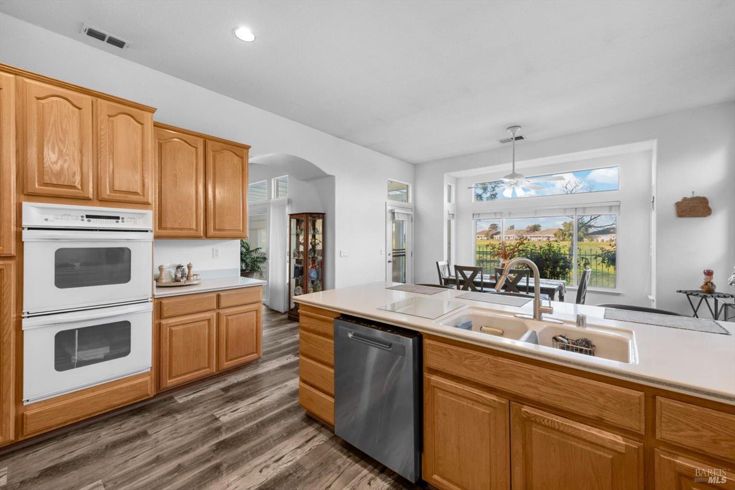 2121 St Andrews Drive Rio Vista, CA 94571 - Photo 13 of 53 a kitchen with stainless steel appliances granite countertop a sink stove and refrigerator