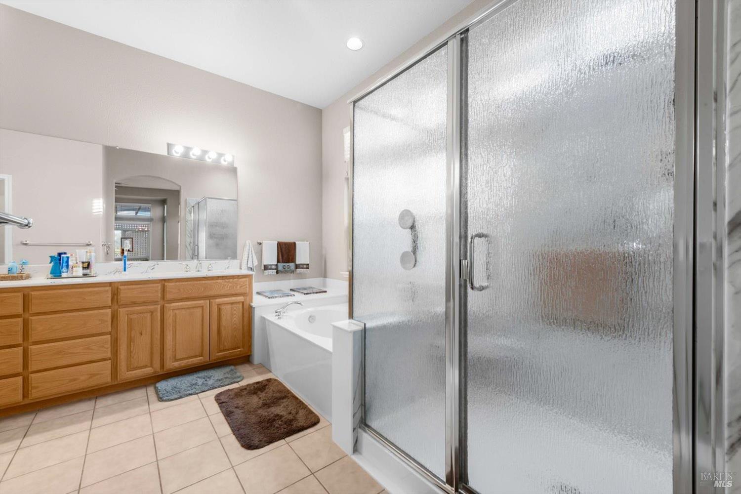 2121 St Andrews Drive Rio Vista, CA 94571 - Photo 22 of 53 a large bathroom with a glass shower door and a mirror