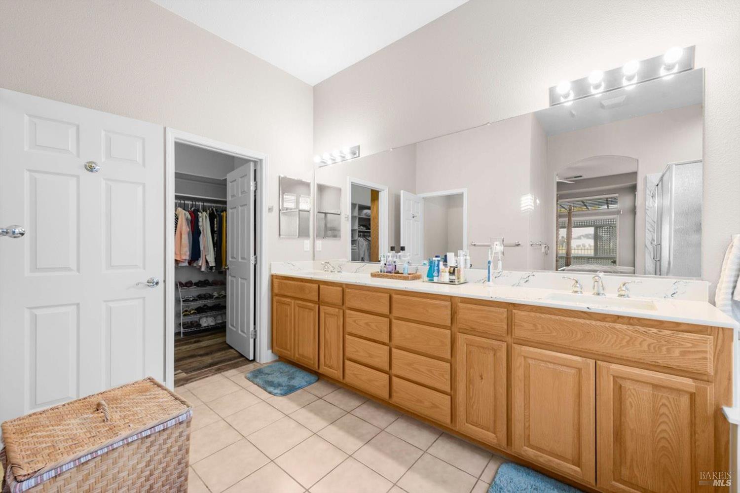 2121 St Andrews Drive Rio Vista, CA 94571 - Photo 23 of 53 a spacious bathroom with a granite countertop sink mirror and cabinets