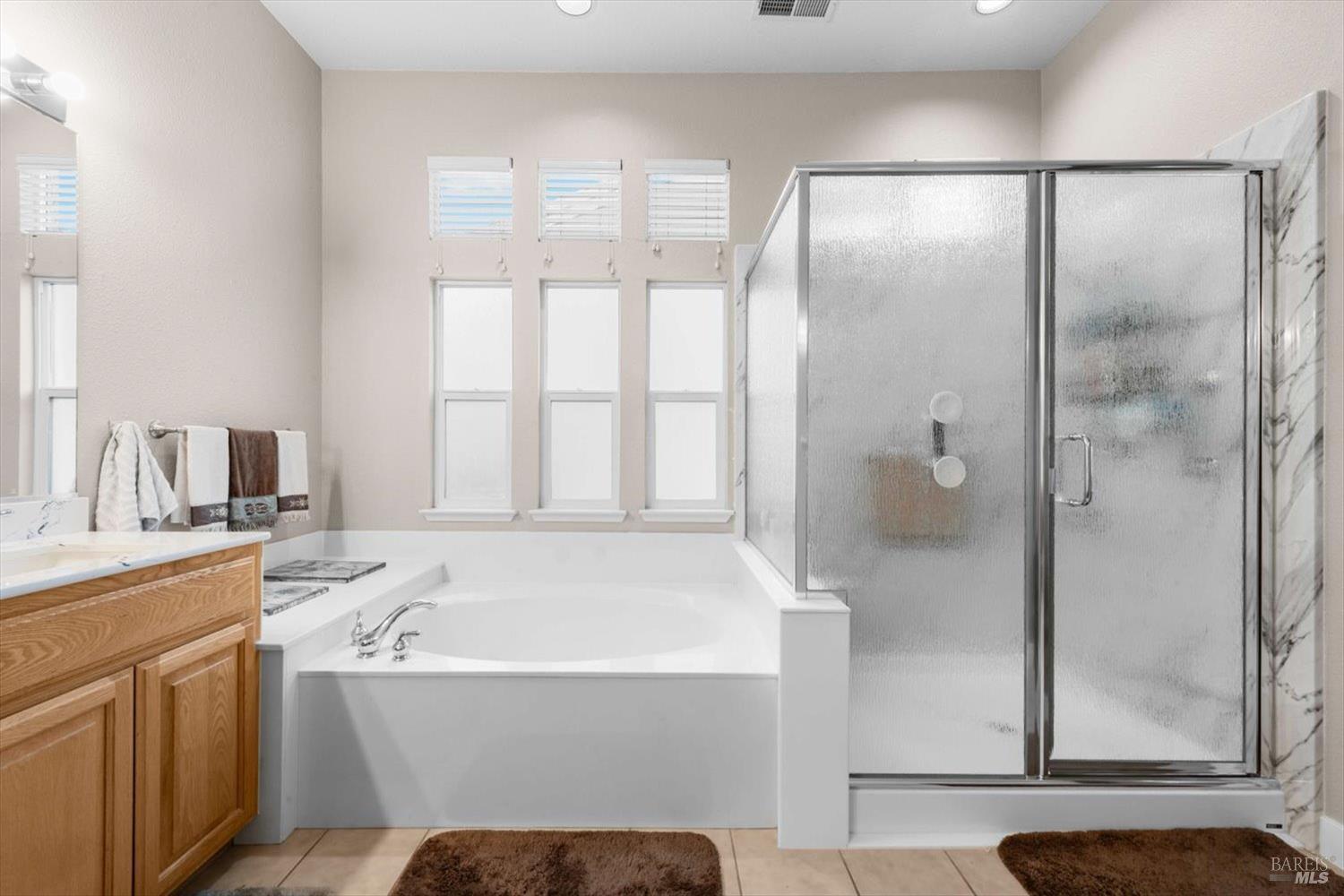 2121 St Andrews Drive Rio Vista, CA 94571 - Photo 25 of 53 a bathroom with a bathtub sink and mirror