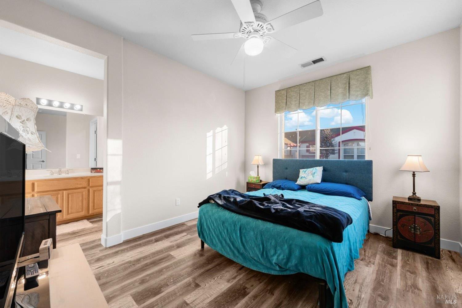 2121 St Andrews Drive Rio Vista, CA 94571 - Photo 29 of 53 a bedroom with a bed window and a mirror