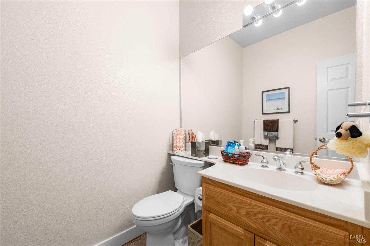 2121 St Andrews Drive Rio Vista, CA 94571 - Photo 34 of 53 a bathroom with a granite countertop toilet sink and mirror
