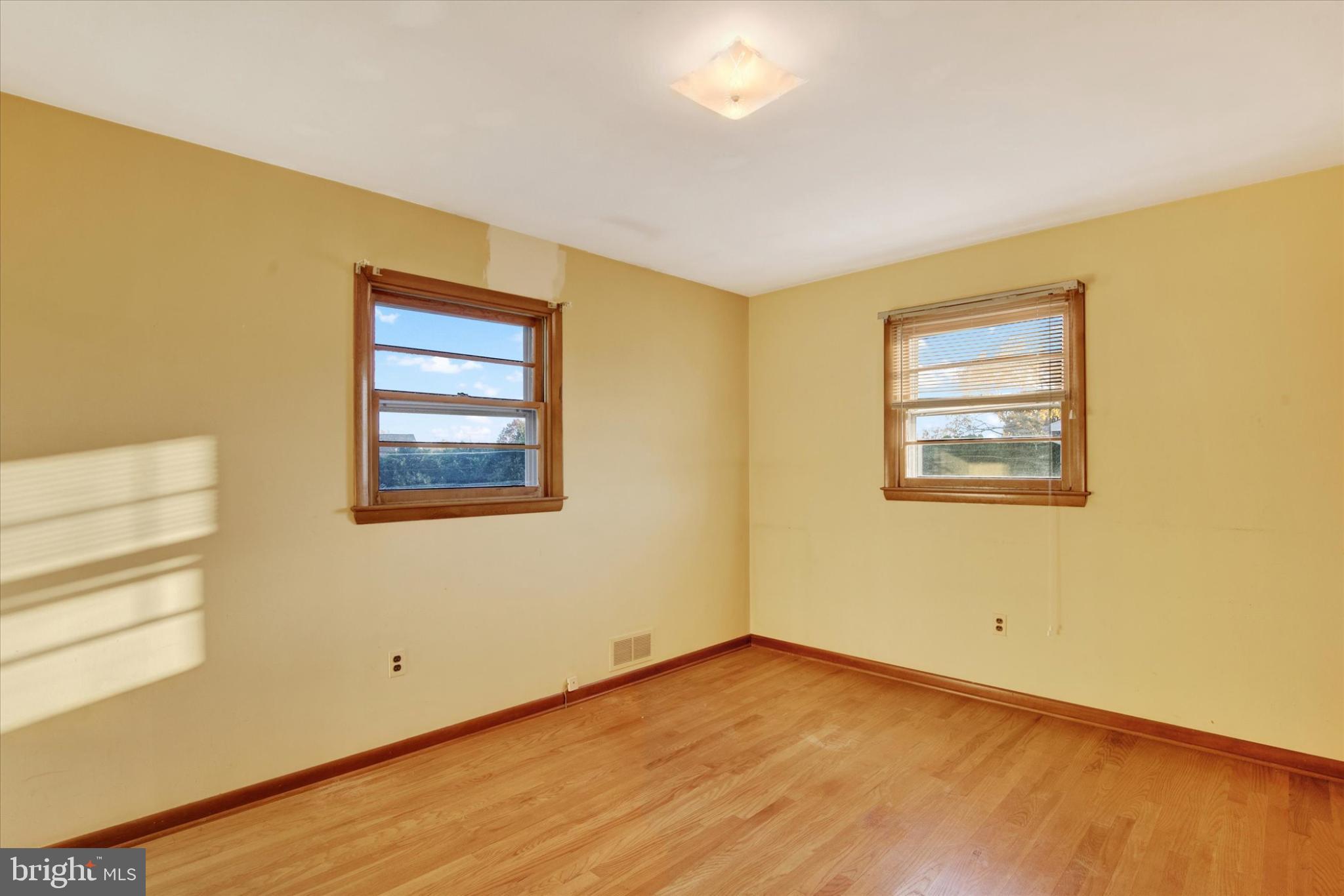 1505 Southview Road Bel Air, MD 21015 - Photo 14 of 25 a view of an empty room with wooden floor and a window